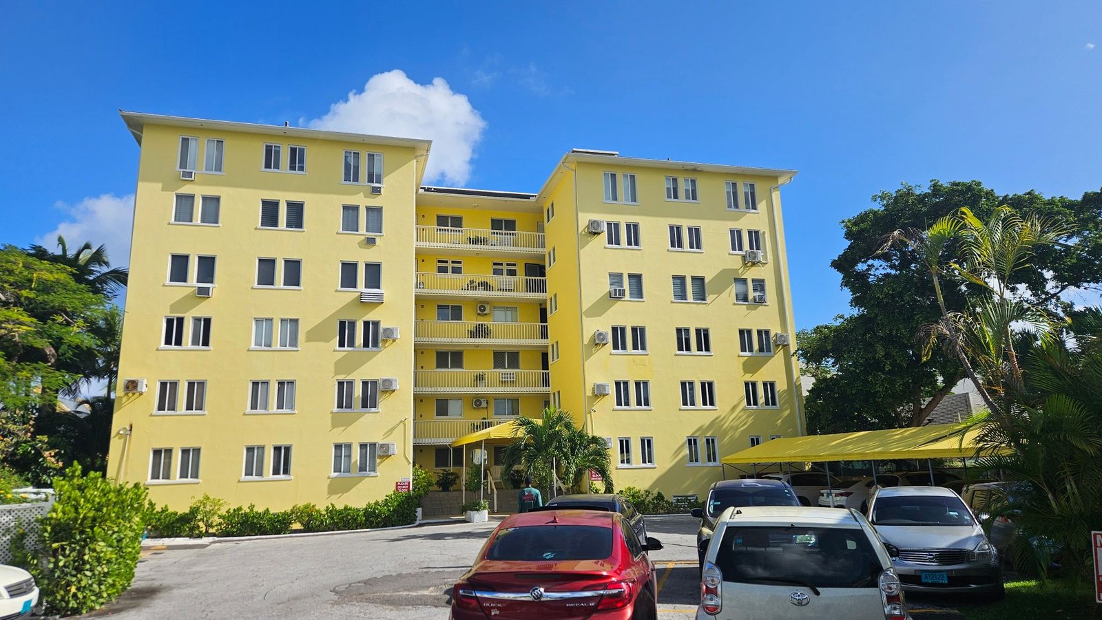 Six-storey yellow apartment building at Carefree, Cable Beach